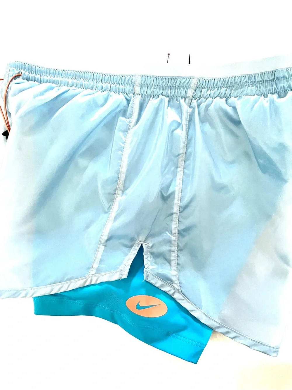 Nike Light Blue Women's Athletic Shorts with Orange Drawstring